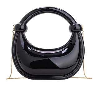 Glossy black crescent dumpling bag with large round handle and fine gold chain strap