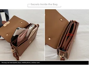 Detail showing the internal storage capacity and compartments of the brown leather handbag