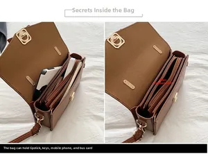 Vue détaillée de l'intérieur du sac à main marron montrant les compartiments de rangement