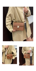 Detail showing brown lychee pattern leather handbag with gold metal twist lock buckle