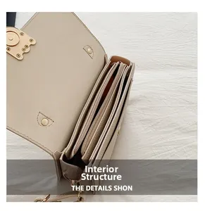 Internal structure of the cream tote bag showing organized compartments and zipper pockets