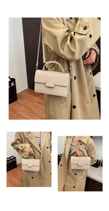 Detail of beige lychee leather small square bag with metal buckle and adjustable strap