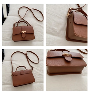 Detail view showing brown lychee grain leather crossbody bag with gold hardware buckle