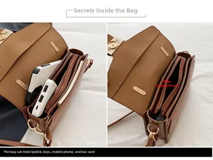 Détail intérieur du sac bandoulière marron avec compartiments pour téléphone et clés