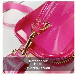 Detail shot of the detachable metal hook and zipper on this pink transparent PVC bag