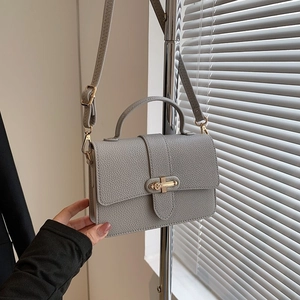 Minimalist grey square crossbody bag with lychee texture and gold metal lock detail