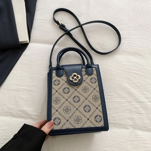 Classic small square shoulder bag with blue leather trim and monogram print design