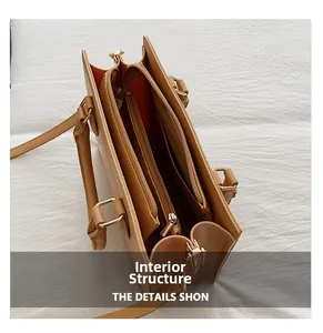 Internal structure of the tan tote bag with three compartments and golden zippers