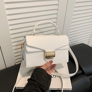 Minimalist white leather crossbody bag with gold buckle and top handle for women