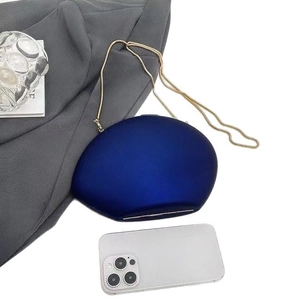 Oval royal blue acrylic evening clutch bag with gold snake chain and smartphone size reference