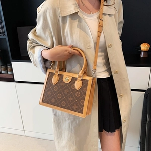 Vintage brown monogram handbag with CACATOES pattern and adjustable leather strap
