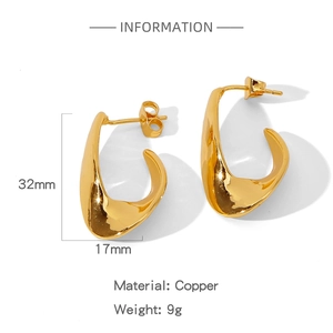 Detailed view of golden irregular C-shaped earrings with product size and material info