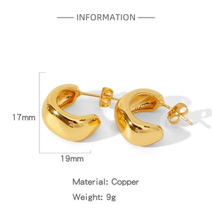 Detailed specs of chunky irregular gold geometric earrings made of polished copper