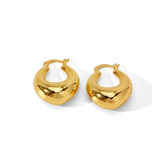 Polished gold irregular chunky hoop earrings with a wide teardrop silhouette for women