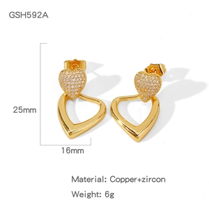 Macro shot of gold heart earrings with white zircon, size 25mm x 16mm, copper material