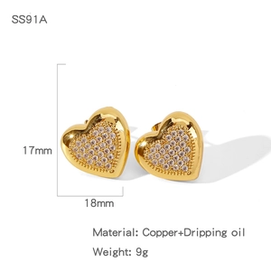 Detail view of heart-shaped gold studs with clear zircons measuring 17mm by 18mm
