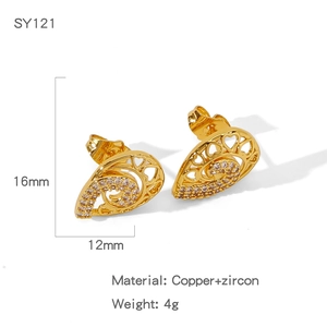 Detailed macro shot of gold heart planet earrings featuring clear zircon inlays and copper base