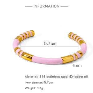 Close-up of pink enamel bamboo-style 316L stainless steel bangle showing its 6mm width