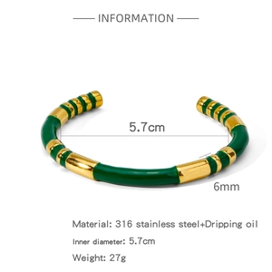 Detailed macro of 316L stainless steel C-shape bangle with green enamel bamboo texture