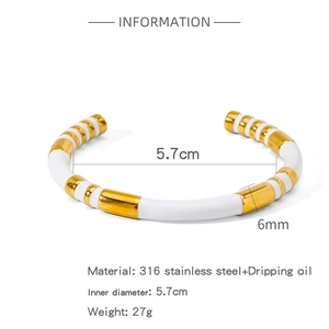 Close-up of white enamel bamboo style bangle with dimensions and 316L stainless steel info