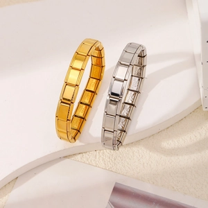 Polished stainless steel Italian charm bracelets in gold and silver on stone