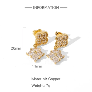 Detail view of gold clover earrings with square crystal, showing dimensions 26mm by 11mm