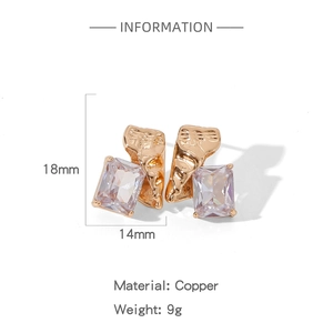 Detail showing 18x14mm textured golden copper earrings with rectangular zircon