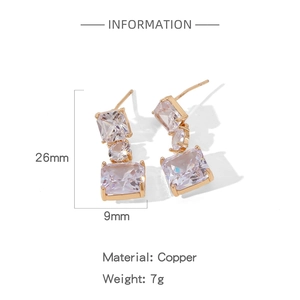 Macro view of geometric gold earrings with rectangular zircon and copper dimensions