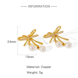 Detailed view of 24mm gold butterfly earrings with zircon inlay and pearl drops