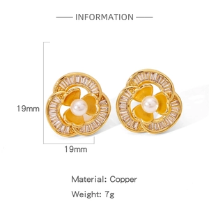 Detailed view of golden flower earring with central pearl and inlaid stones, 19mm size