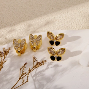 Elegant gold butterfly earrings set with zircon stones and black enamel accents