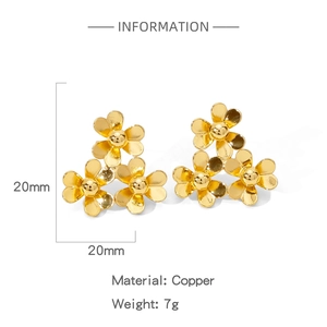 Detail showing 20mm copper floral stud earrings with mirror polished gold finish