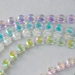 Detail of iridescent acrylic ribbed beads showing vibrant rainbow colors and textures