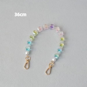 Detail of 36cm iridescent acrylic bead strap with white pearls and gold lobster clasp