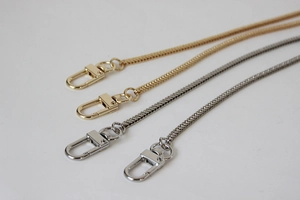 Close-up of 3mm flat snake chain straps in gold and silver with lobster clasps
