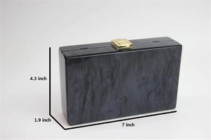 Detailed size specifications for the marble acrylic clutch showing 7x4.3x1.9 inches