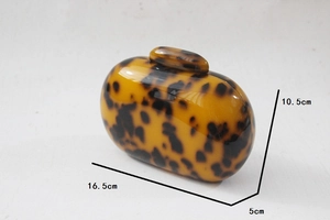 Detailed size view of round leopard acrylic evening clutch bag showing 16.5x10.5x5cm dimensions