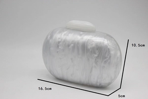 Detail view of round white marble texture acrylic evening clutch with dimensions and pebble clasp