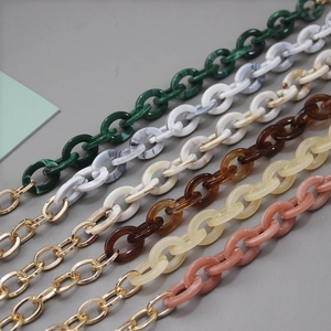 Multi-colored acrylic resin handbag chain straps with gold metal clasps detail