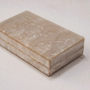 Elegant cream marble acrylic clutch bag with gold metal frame for weddings