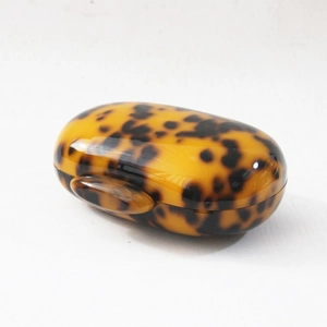 Chic leopard print acrylic evening clutch bag with glossy tortoiseshell finish and round shape