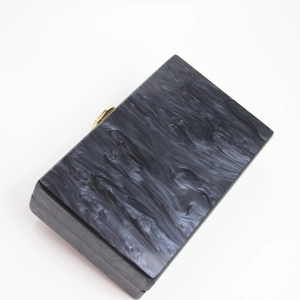 Elegant black and white marble acrylic evening clutch bag with gold metal clasp