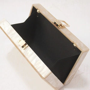 Elegant white marble acrylic clutch evening bag with gold metal clasp and black lining