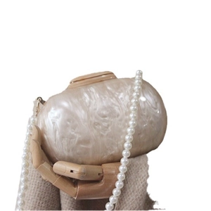 Elegant creamy white pearl texture clutch bag featuring a detachable long pearl chain strap