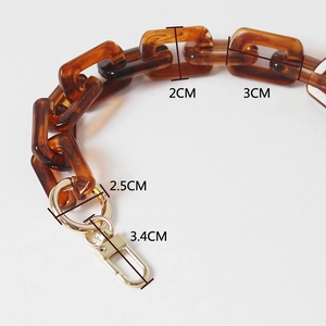 Close-up of leopard tortoiseshell acrylic chain strap with gold lobster clasps and rings