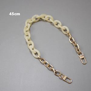Detail view of 45cm handbag strap with cream resin rings and golden metal chain and clasp