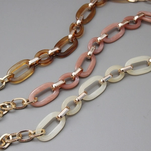 Detailed trio of baroque resin acrylic bag chains in amber pink and cream with gold links