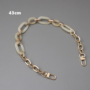 Detail of 43cm cream resin acrylic and gold metal link chain strap with lobster clasps