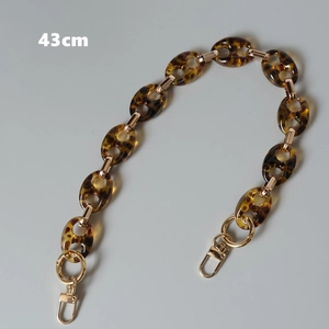 Detail view of 43cm leopard print acrylic chain strap with gold lobster clasps