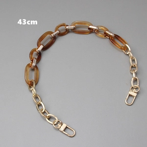 Detail view of 43cm amber resin and gold metal chain strap with lobster clasps